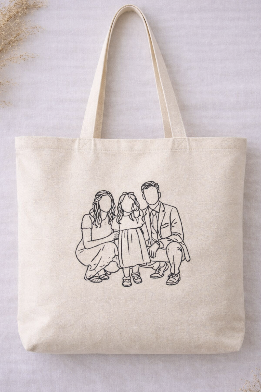 Personalised organic cotton tote bag with custom embroidered family line art portrait
