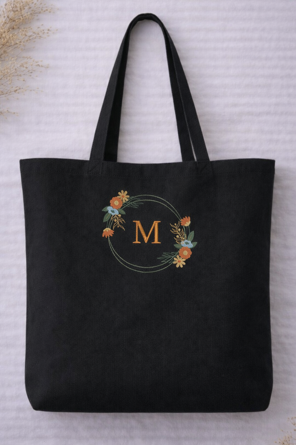 Black organic cotton tote bag with personalised embroidered floral monogram initial