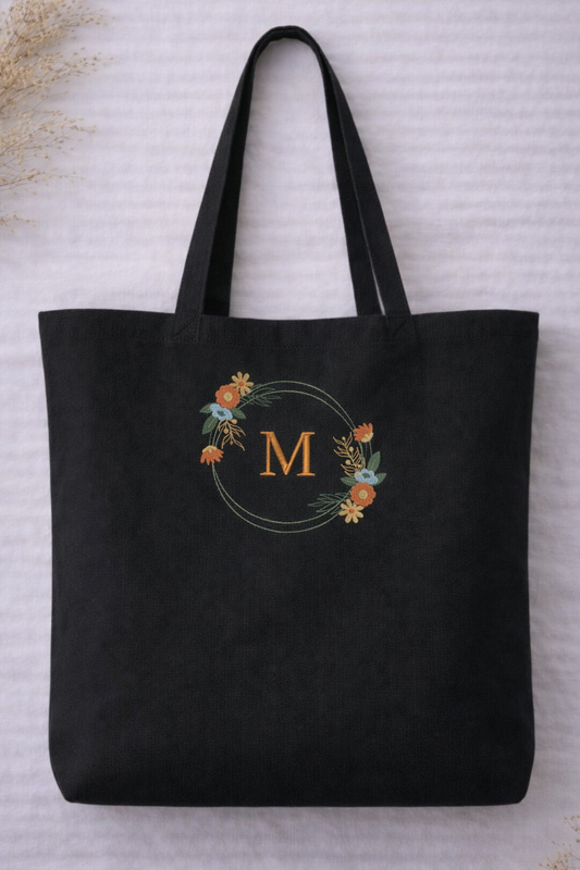 Black organic cotton tote bag with personalised embroidered floral monogram initial